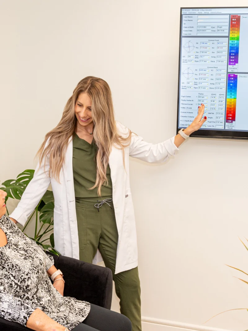 Dr. Ariel Cerenzie consulting with parent and patient on personalized low-dose atropine therapy