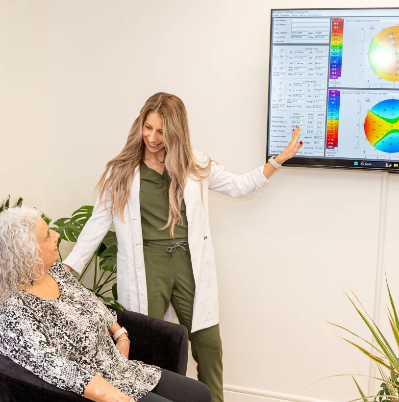 Doctor examining keratoconus patient using advanced anterior segment slit lamp imaging