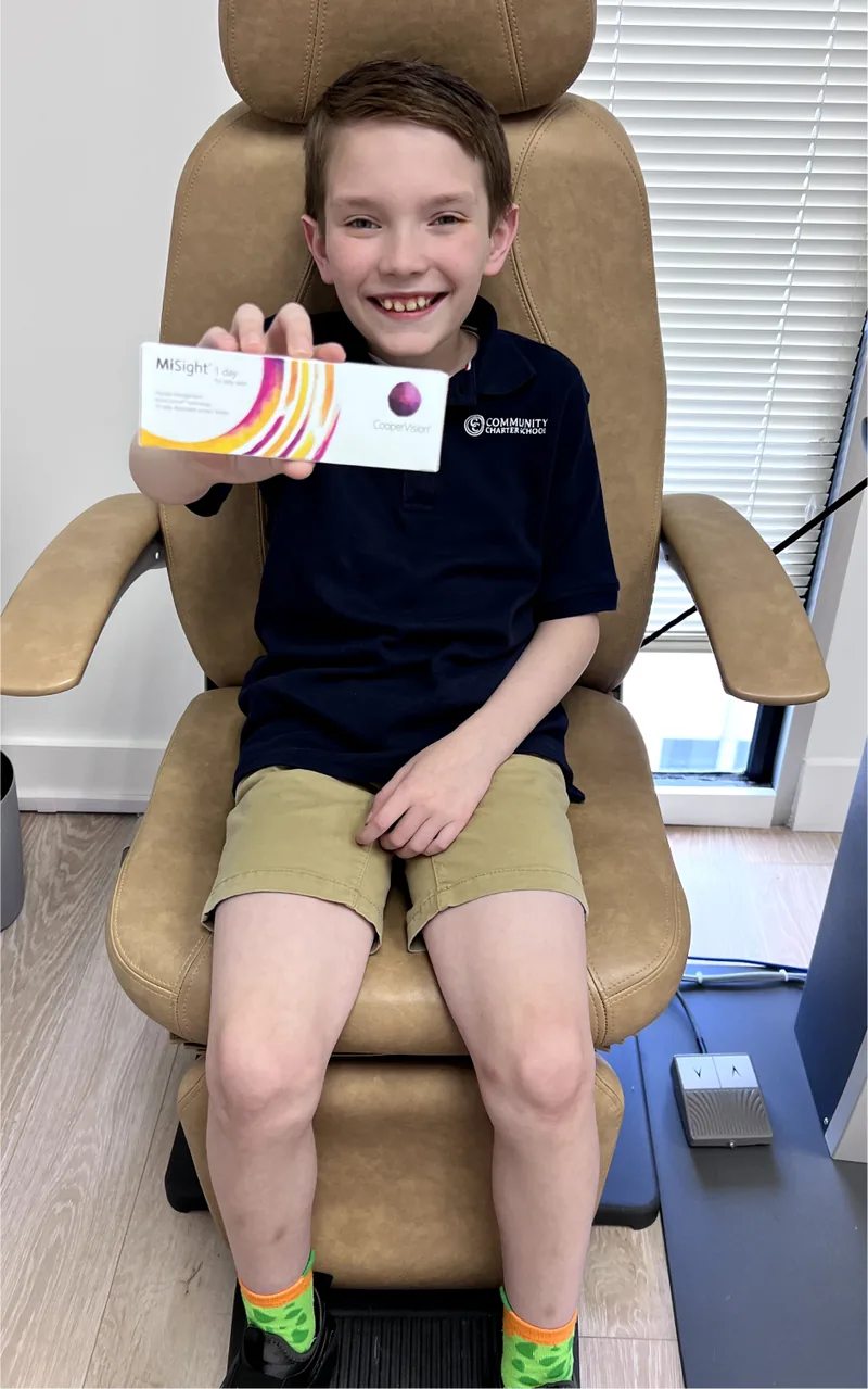 Child happily playing sports with CooperVision MiSight 1 Day contact lenses