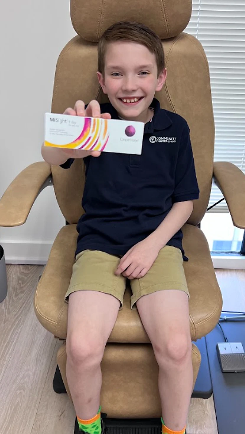 Young patient smiling while comfortably wearing MiSight 1 day contact lenses