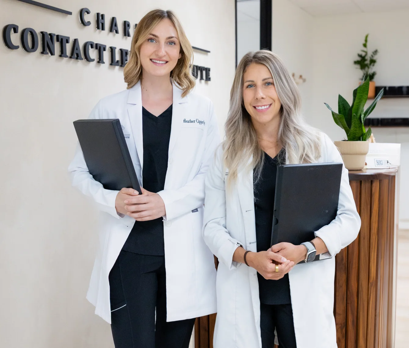 Two Charlotte Contact Lens Institute doctors standing in the reception area