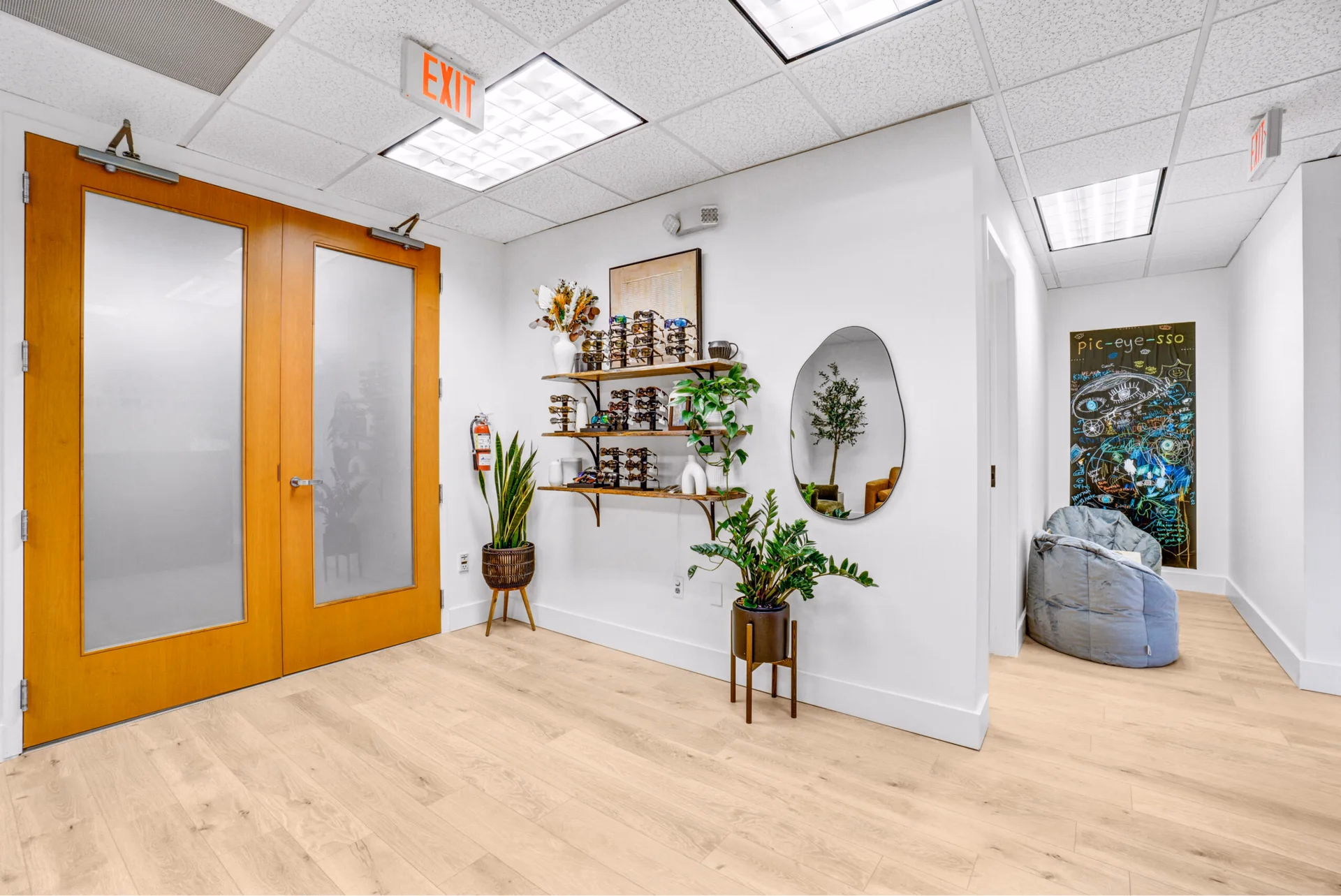 Office entry, eyewear display, and hallway to the exam rooms