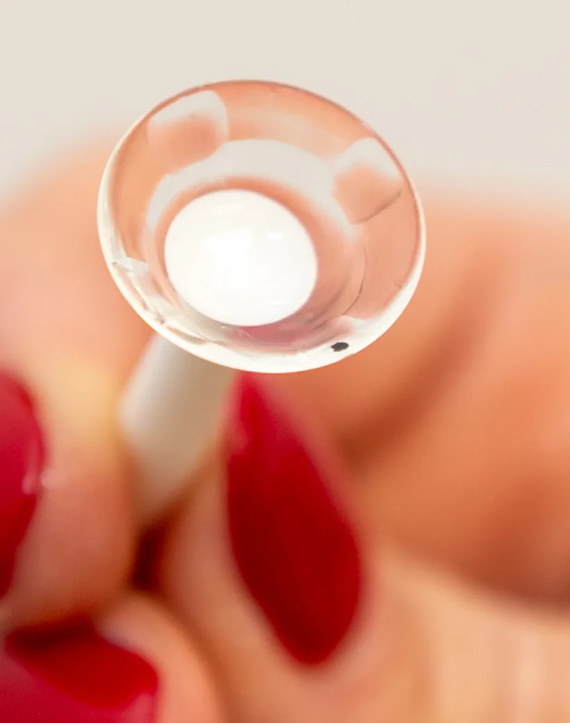 Custom SynergEyes hybrid contact lens demonstrating rigid center and soft silicone hydrogel skirt